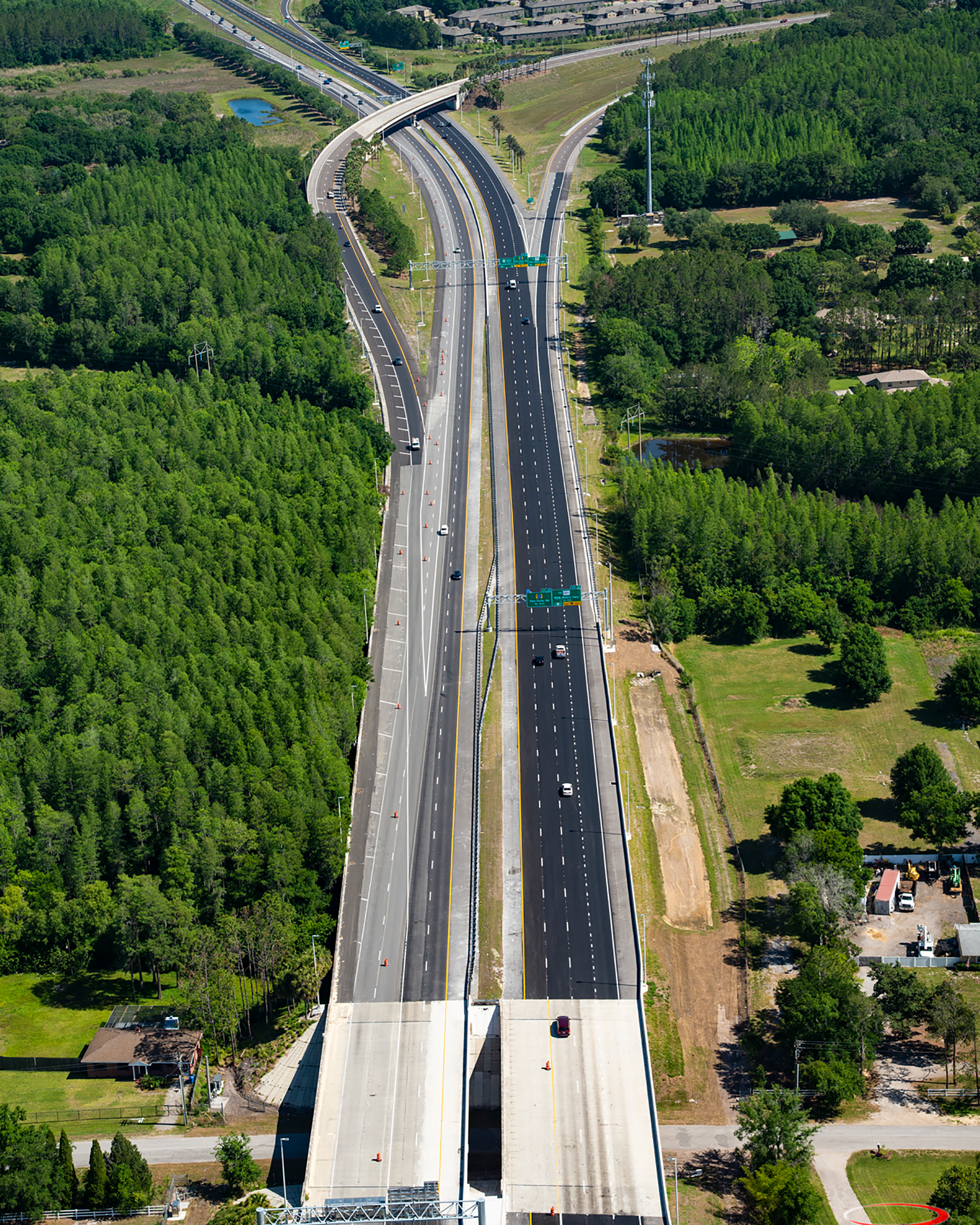 Aerial view of a highway with a level crossing